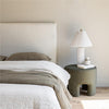 Wide lifestyle shot of the master suite featuring the Julia bed as the central minimalist focal point