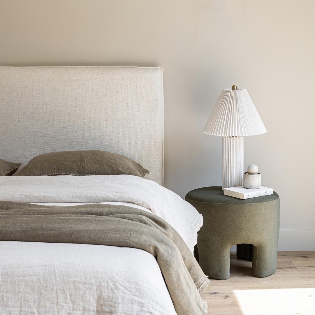 Front view highlighting the soft textured upholstery and the clean architectural lines of the bed frame