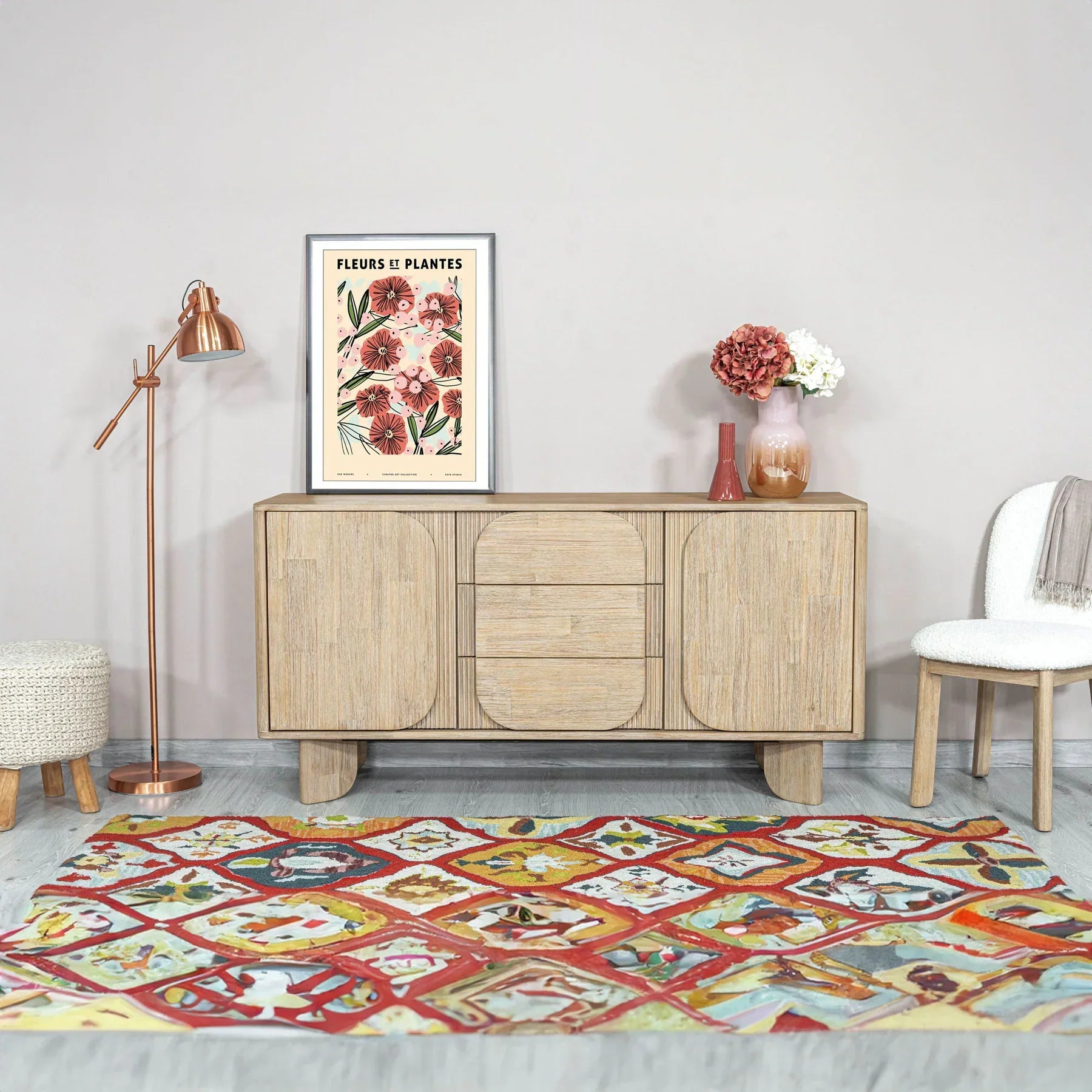 Front perspective view of the Haru sideboard in a light oak finish featuring unique rounded door and drawer panels with a minimalist plinth base