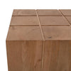 Close-up high-angle view showcasing the unique nine-square grid pattern on the top surface of the wood block table