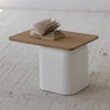 Sereno minimalist side table styled with an open book in a bright room