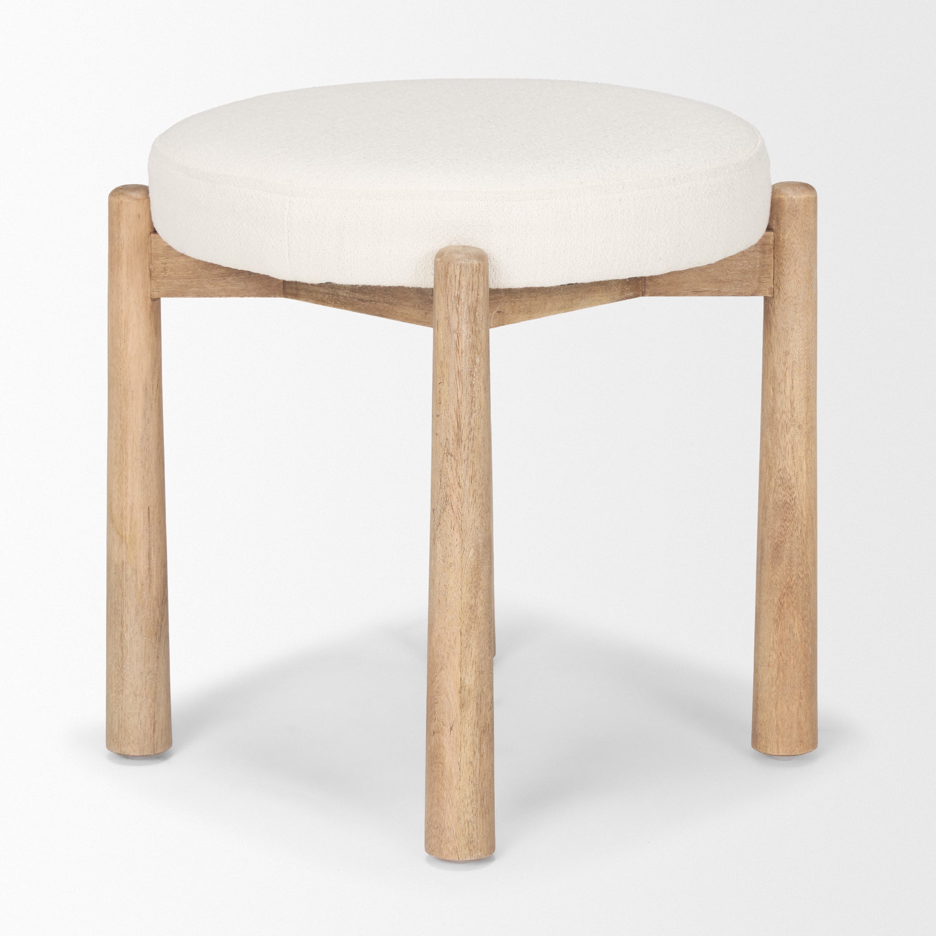 Front three-quarter view of the Shaiden stool featuring a light brown wood frame and a circular cream upholstered seat
