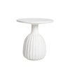 Front view of the shorter variant in the collection featuring the same textured white finish and wide fluted base