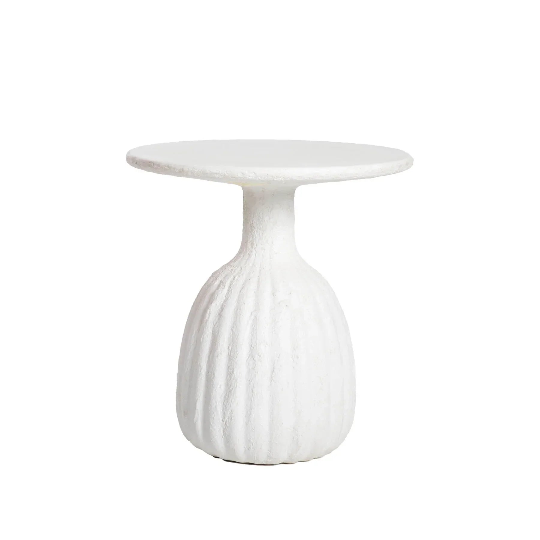 Front view of a white minimalist side table featuring a circular top and a unique fluted hourglass pedestal base with a textured plaster-like finish
