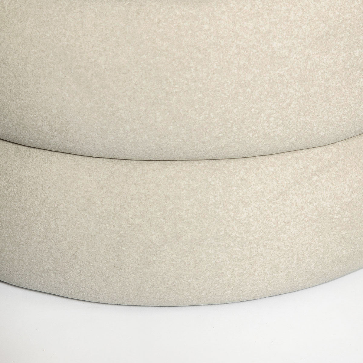 Close-up detail highlighting the plush sand velvet fabric and the clean horizontal seams of the stacked ottoman layers