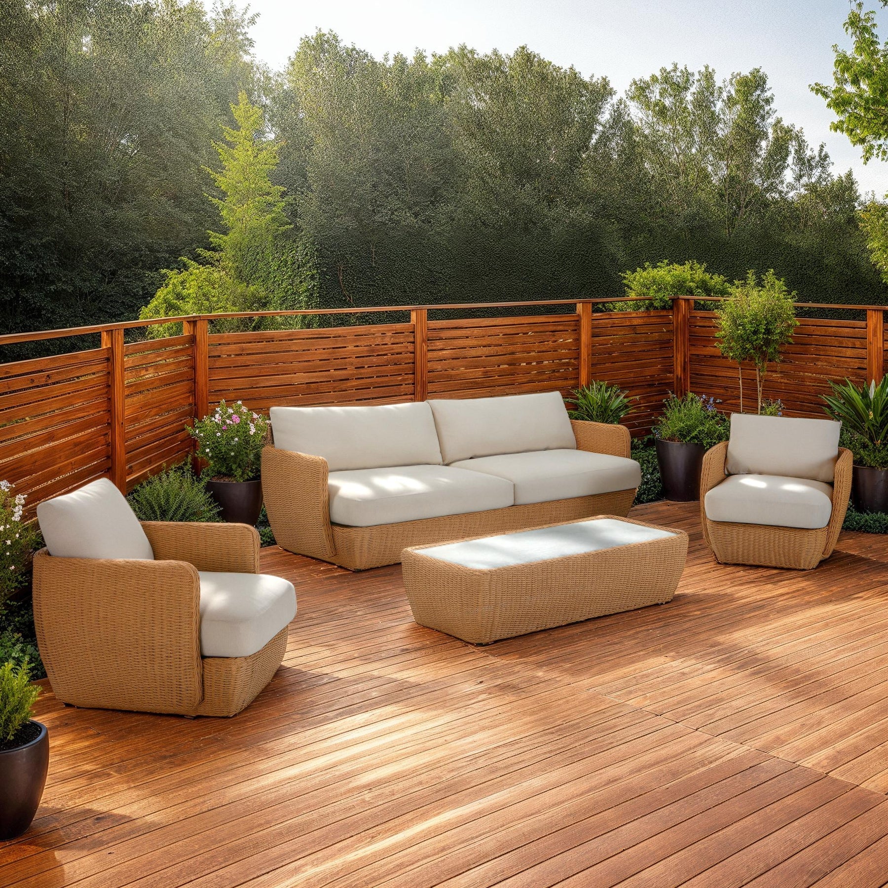 Lifestyle shot showing a pair of Siesta club chairs styled on a wooden deck with a matching sofa and coffee table