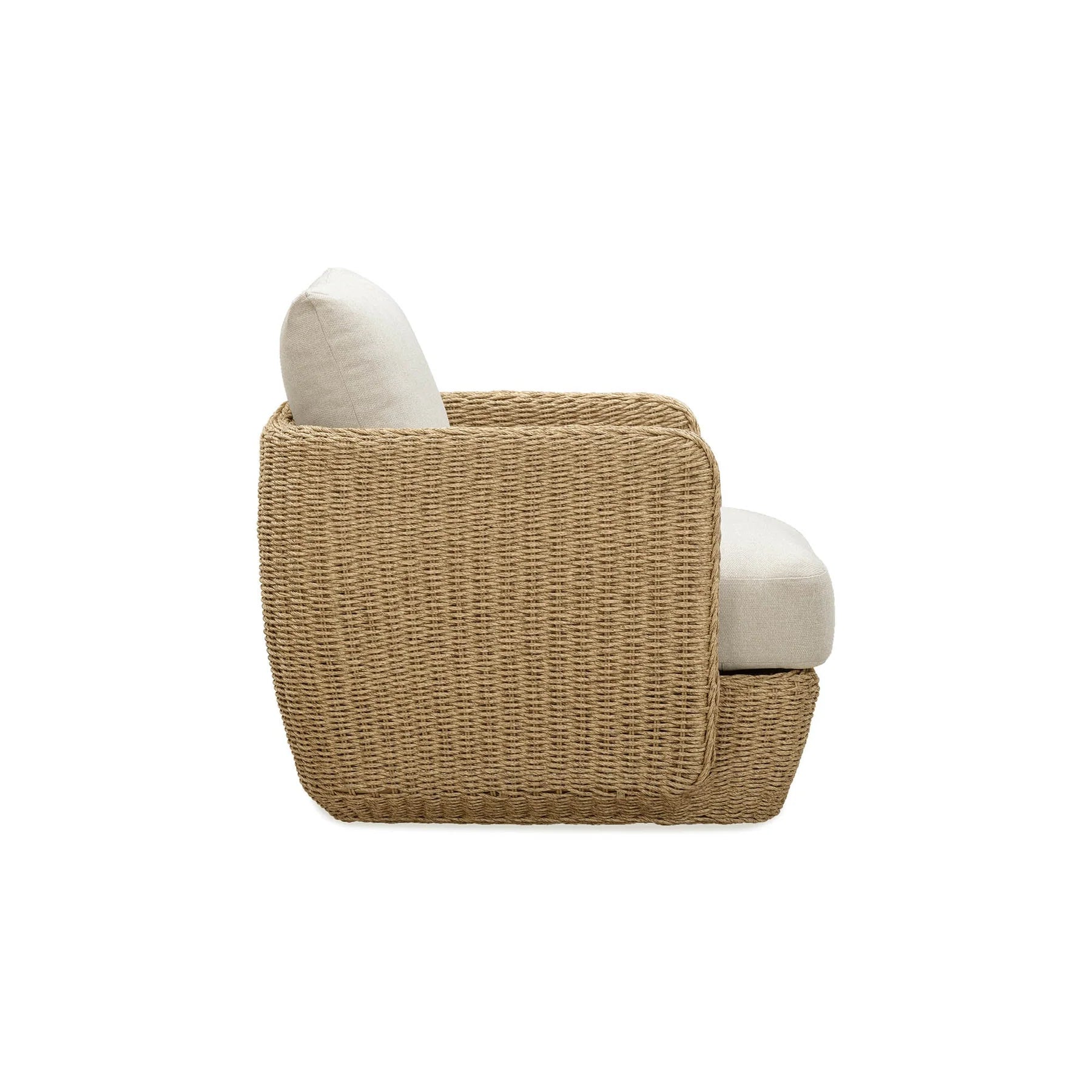 Side profile highlighting the deep-seated ergonomic design and the sturdy woven wicker base of the Siesta club chair