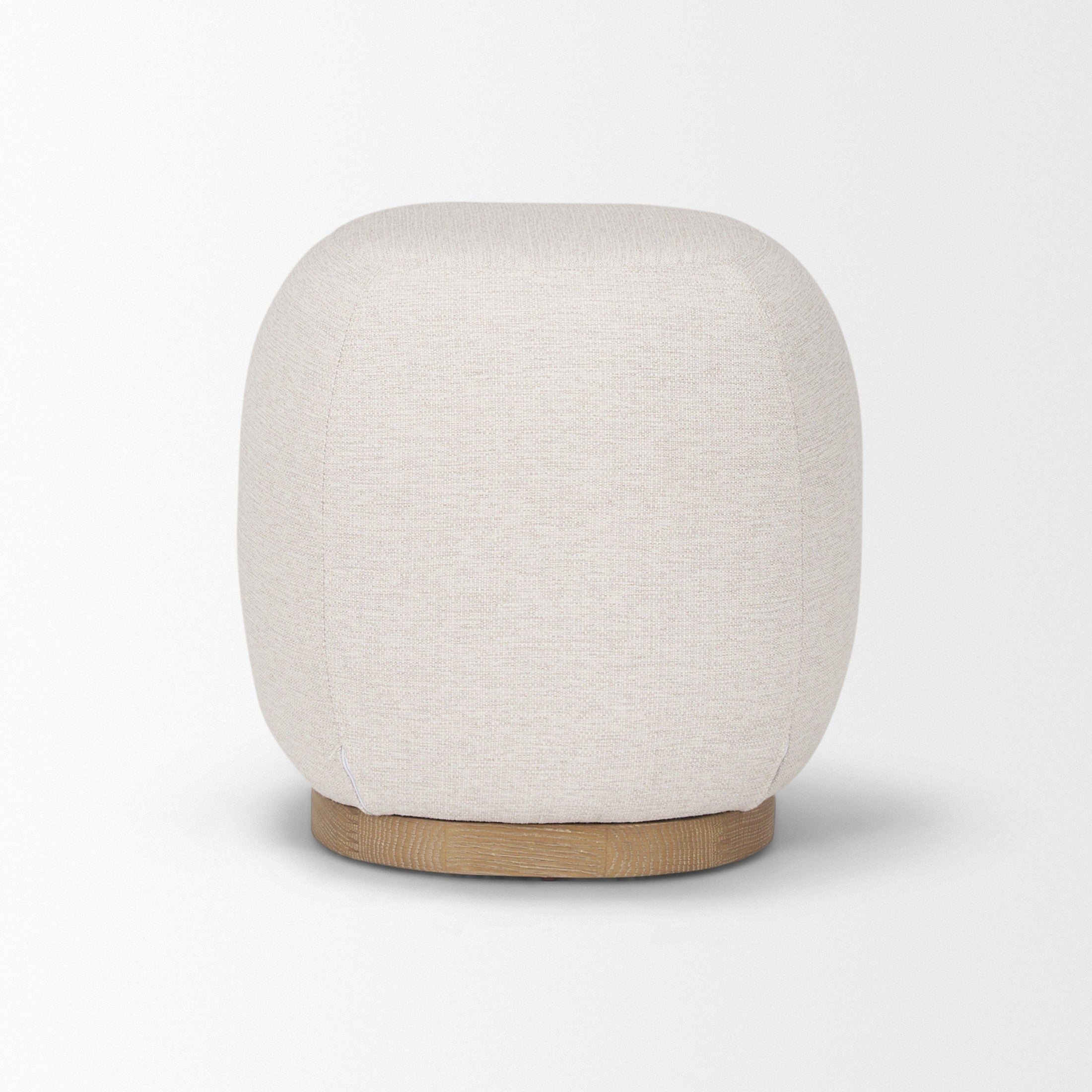 Front three-quarter view of the Siren round accent stool featuring cream textured fabric and a light brown wood base