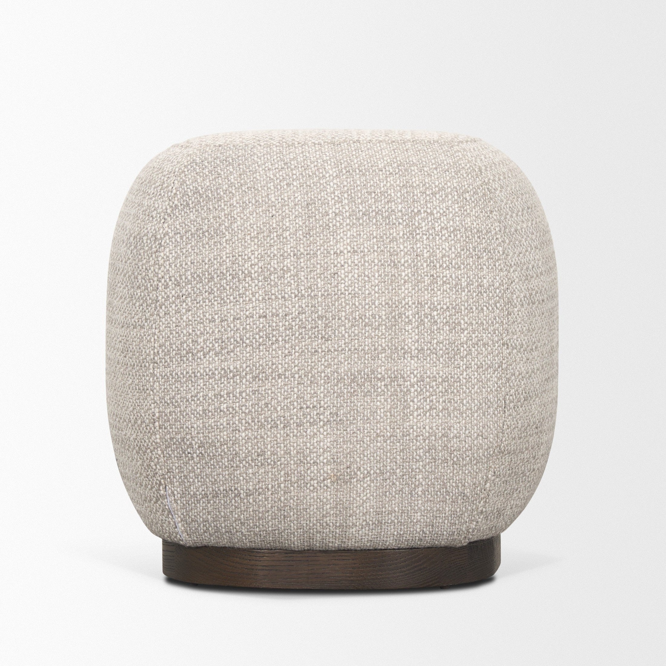 Front three-quarter view of the Siren round accent stool featuring cream textured fabric and a light brown wood base