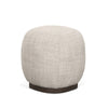 Close-up high-angled view highlighting the soft woven cream fabric and rounded pebble-like form of the Siren stool