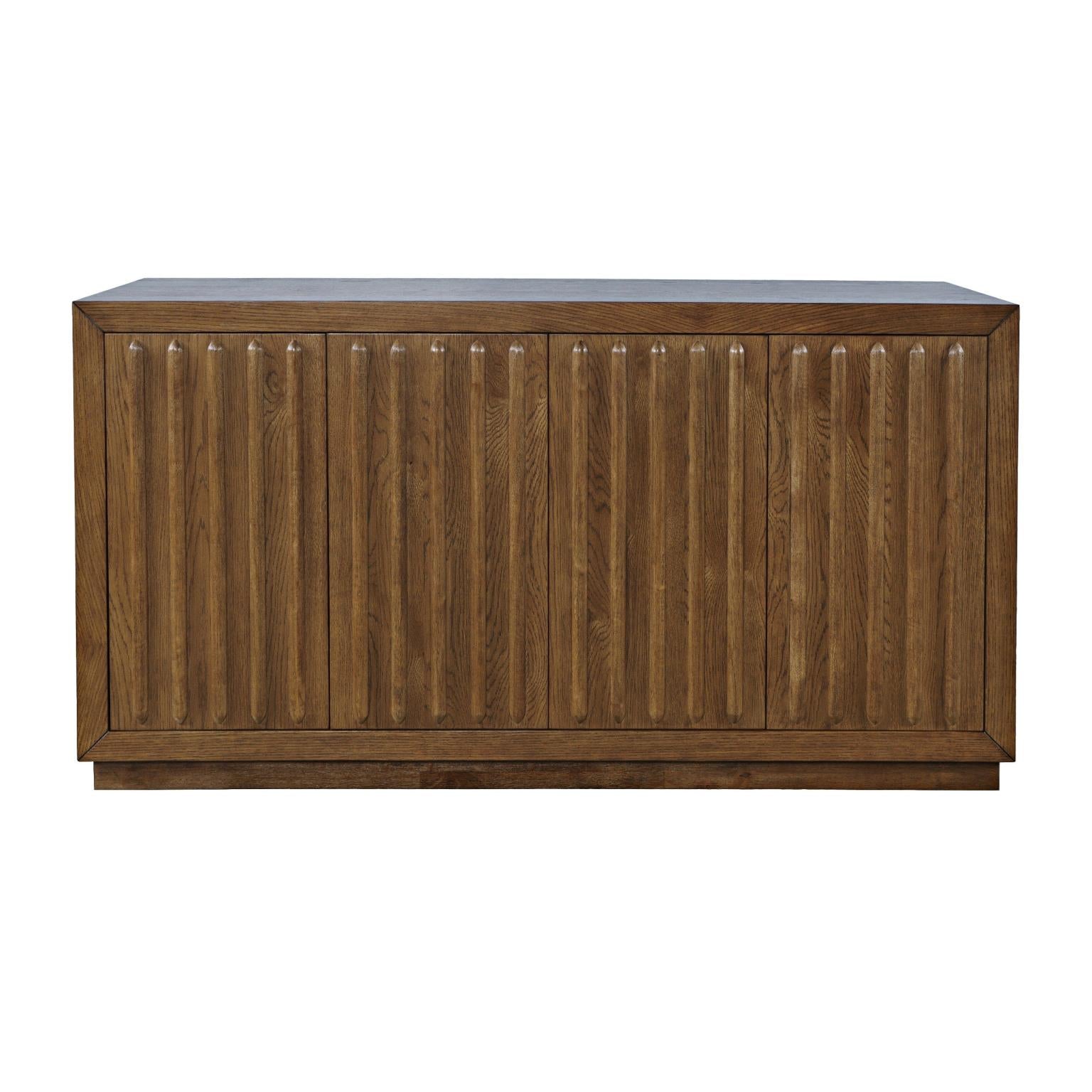 Front perspective view of the Skap 4-door sideboard in a dark oak finish featuring vertical fluted door panels and a matching plinth base