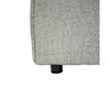 Close-up view of the low-profile black circular support feet on the Skive modular sectional