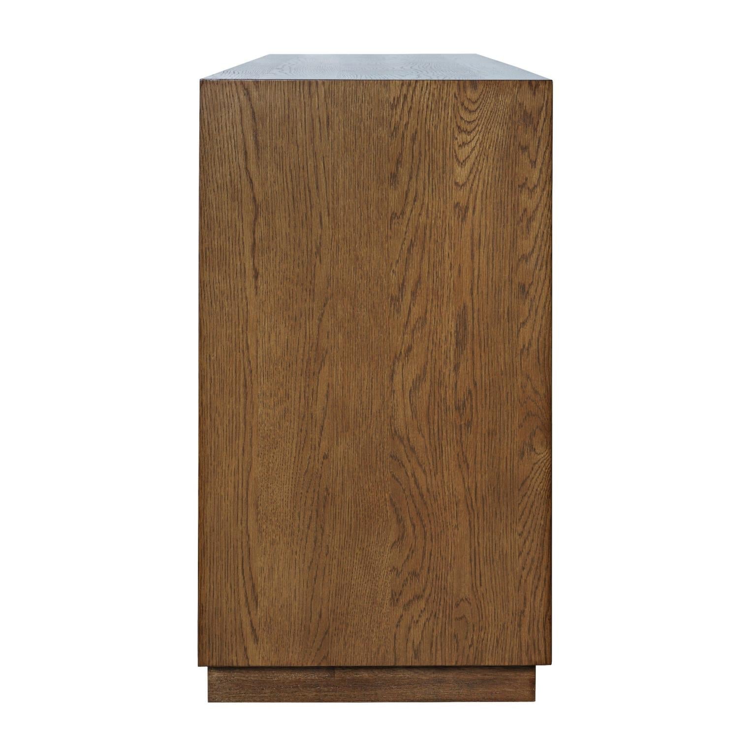 Front perspective view of the Skap 4-door sideboard in a dark oak finish featuring vertical fluted door panels and a matching plinth base