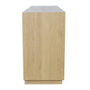 Side profile view of the natural oak sideboard highlighting the architectural vertical lines and low-profile base