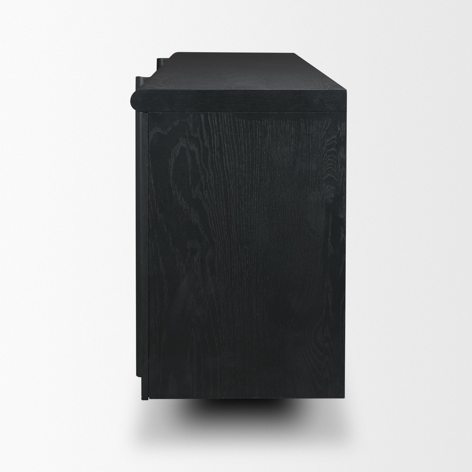 Side profile view of the black sideboard highlighting the deep vertical storage and the architectural leg profile