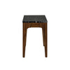 Side profile shot emphasizing the slender tapered legs and the architectural cutout design of the walnut wood base