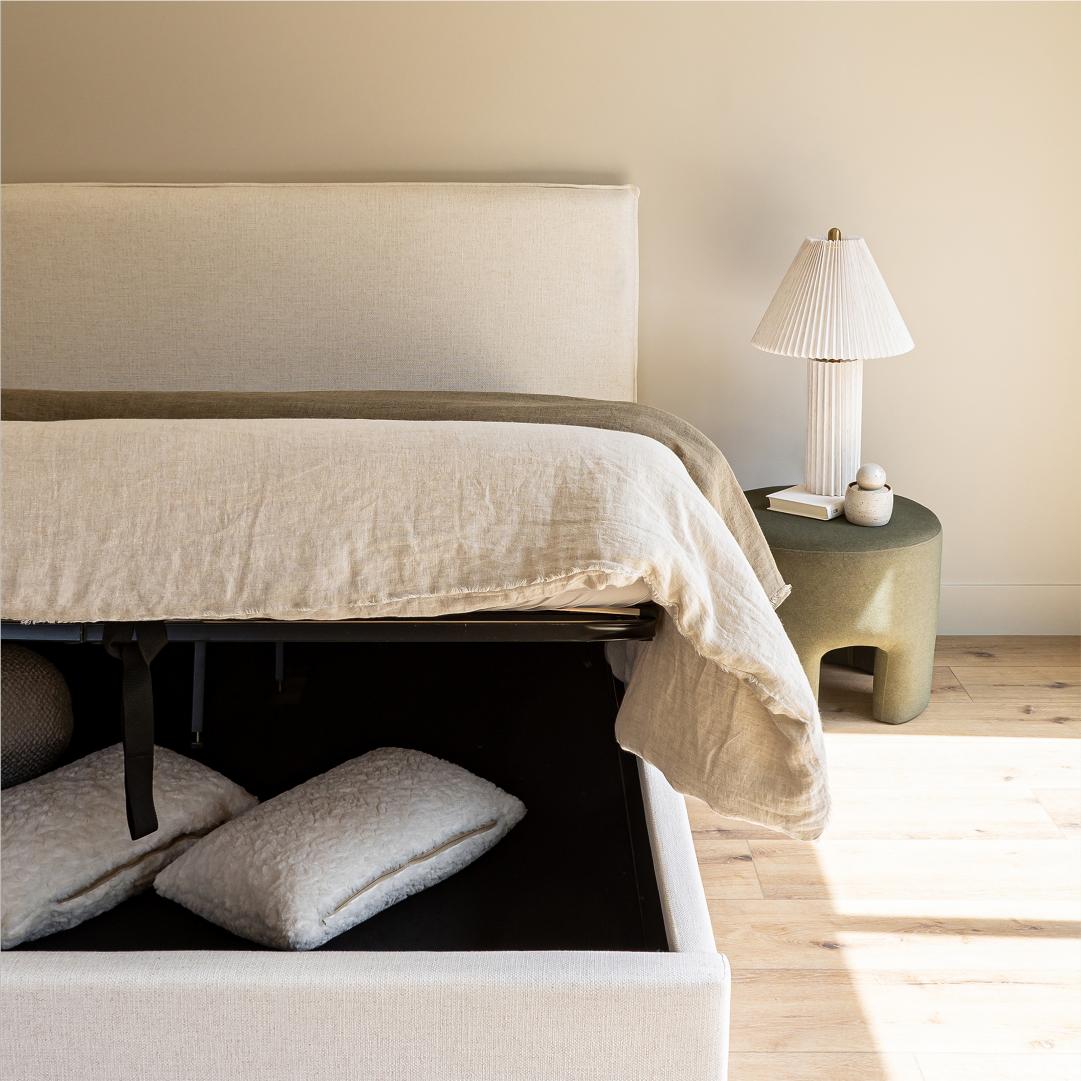 Front view highlighting the soft textured upholstery and the clean architectural lines of the bed frame
