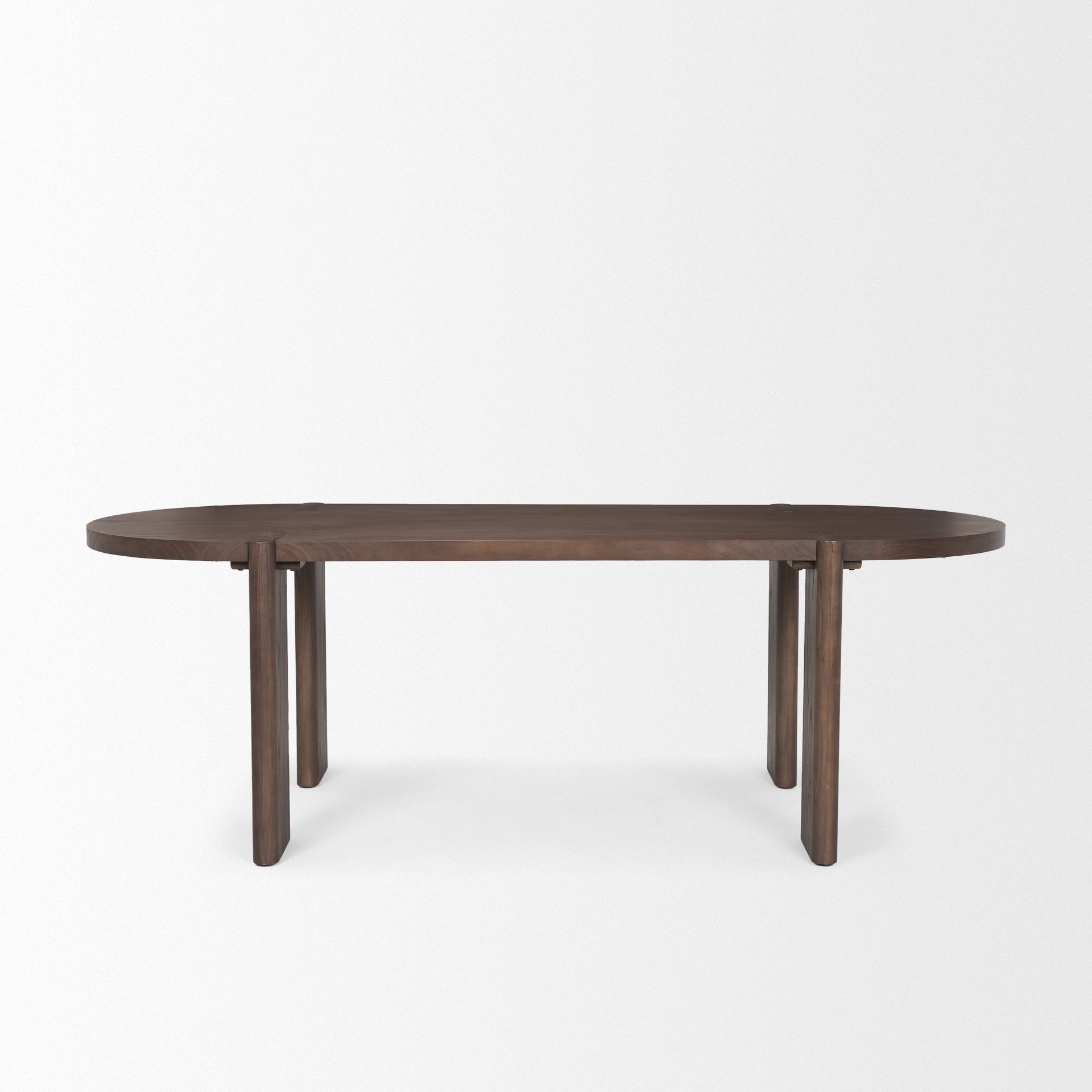Front view of the Sohan oval dining table in a dark elm wood finish featuring smooth rounded edges and sturdy trestle leg supports