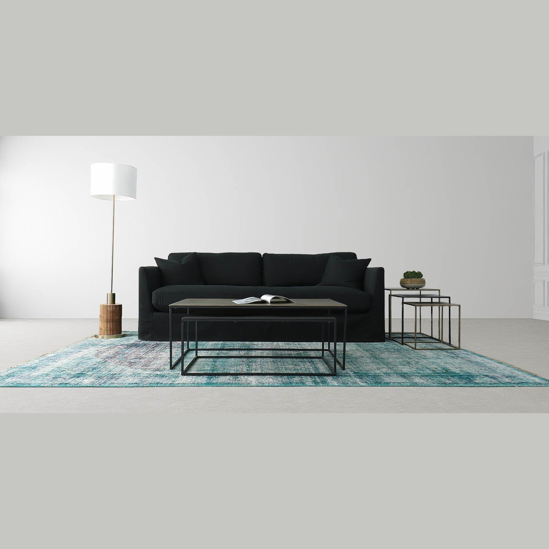 Front view of the Sona nesting table set featuring two square tables with bronze-toned tops and minimalist black metal frames
