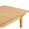 Close-up perspective focusing on the high-quality corner joinery and the elegant tapered wood legs in a light oak finish