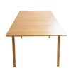 Side profile view emphasizing the slim tabletop depth and the modern architectural lines of the tapered leg base