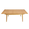 Front view of the Sonet extendable dining table in a natural oak finish featuring tapered legs and a minimalist rectangular silhouette