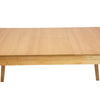 Straight-on front view of the Sonet dining table in its fully extended rectangular form showcasing the seamless leaf integration