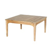 Side profile view showcasing the sturdy construction and slightly tapered legs of the solid wood coffee table