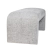 Three-quarter perspective of the light gray Sophia bench showcasing the soft woven texture and architectural curved silhouette