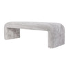 Three-quarter perspective of the light gray Sophia bench showcasing its architectural form and soft edges