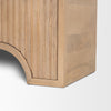 Detail shot of the recessed base and carved tiered arch pattern on Sorina cabinet