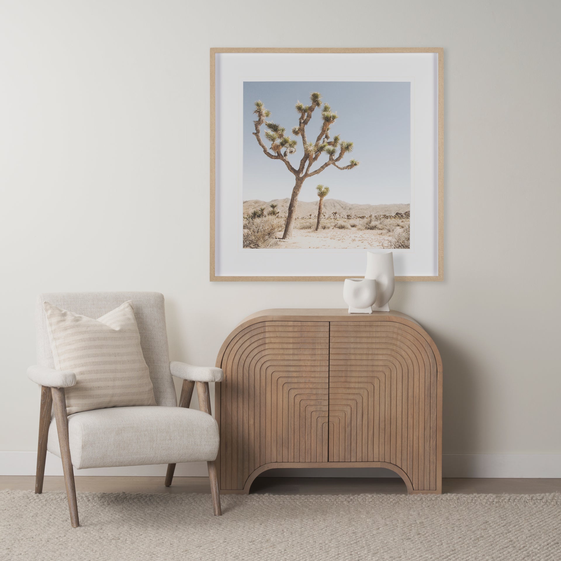 Sorina accent cabinet in light brown wood with reverse fluted arch pattern and curved top