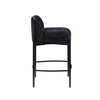 Side profile of the Sorte black fabric counter stool showing its curved backrest