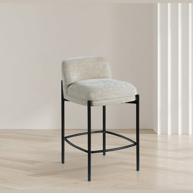 Front view of the Sorte counter stool in black textured fabric with a minimalist black metal frame