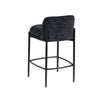 Rear view of the Sorte counter stool highlighting the clean lines of the black metal frame