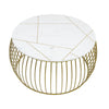 Front view of the Soto round coffee table featuring a white marble top with gold geometric inlays and a gold wire metal birdcage base