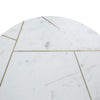 Close-up shot highlighting the precise gold metal geometric line inlays across the white marble surface