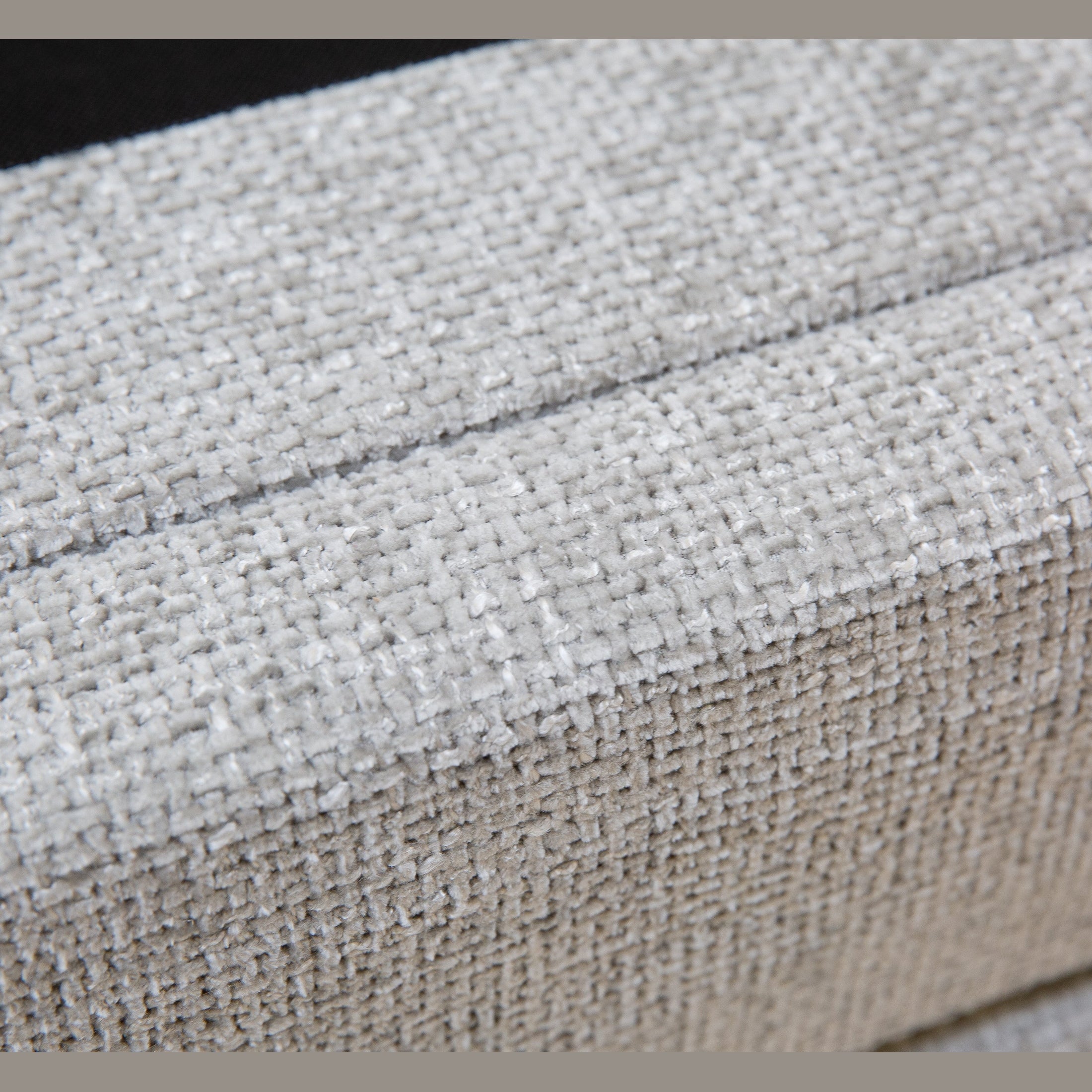 Front view of the Norell storage bed featuring a neutral woven fabric finish and a vertical channel tufted headboard
