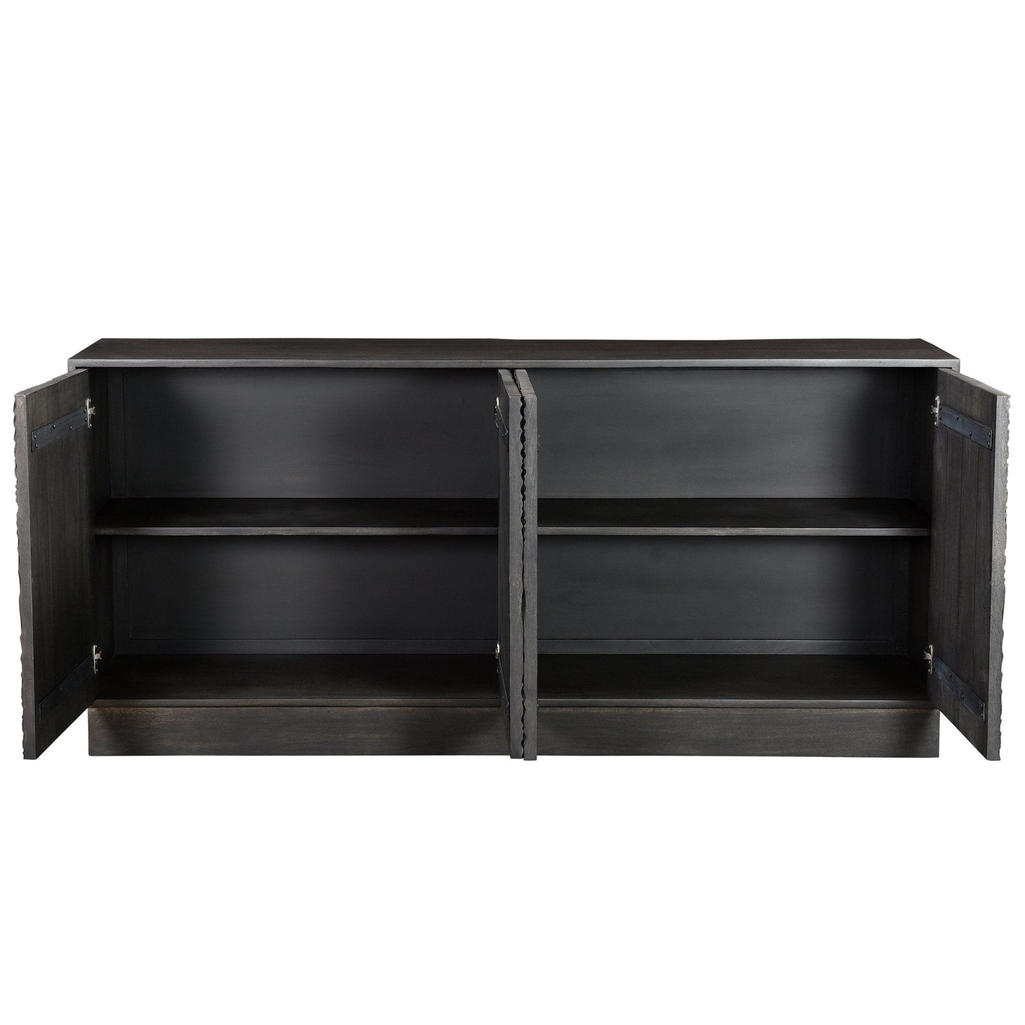 Three-quarter perspective view of the Spiral sideboard featuring a matte black finish and intricate circular relief carvings across four doors