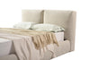 Close-up shot focusing on the high-quality bouclé fabric texture and the central vertical seam of the split-panel headboard