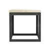 Straight-on front view highlighting the minimalist open cube silhouette and the substantial thickness of the stone tabletop