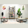 Side profile view showcasing the balanced silhouette of the square stone tabletop on a minimalist tapered base