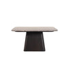 Close-up shot focusing on the vertical wood grain and the sharp geometric edges of the fluted pedestal base