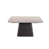 Front view of the Storm coffee table featuring a multi-faceted fluted natural wood base and circular silhouette