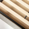 Close-up view of the internal wooden slat system and central support rail designed for mattress stability