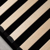 Close-up shot of the internal wooden slat support system designed for mattress breathability and durability