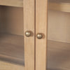 Close up of the round brass knob hardware on the Suri curio cabinet doors
