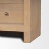 Detail shot of the sturdy wood base and clean leg joinery on the Suri cabinet