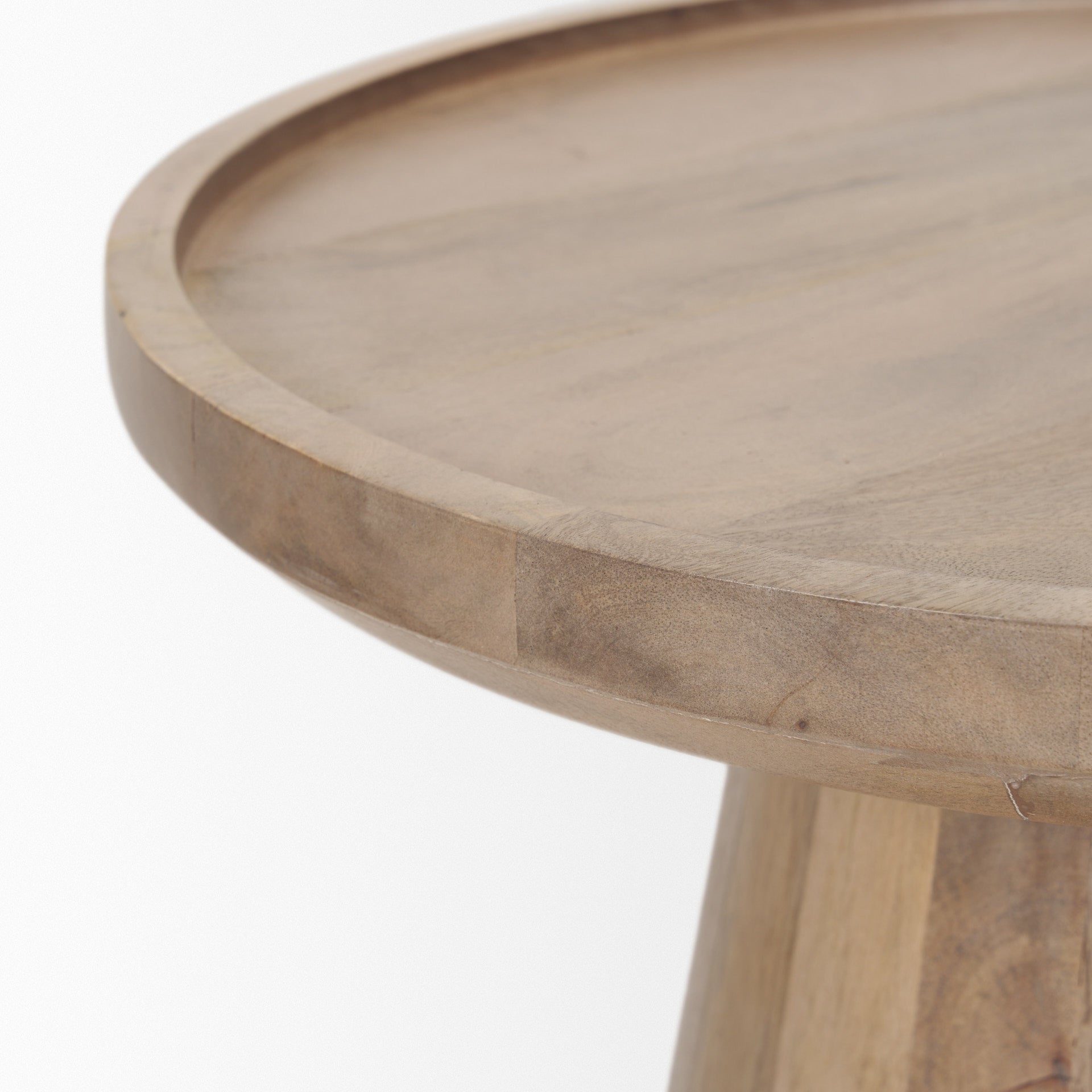 Front view of the Takoda accent table in light brown wood featuring a tapered drum pedestal base and a circular tray-style top