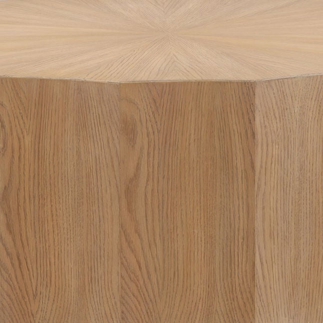 Front view of the Tamsin coffee table featuring a faceted drum silhouette in a natural oak finish